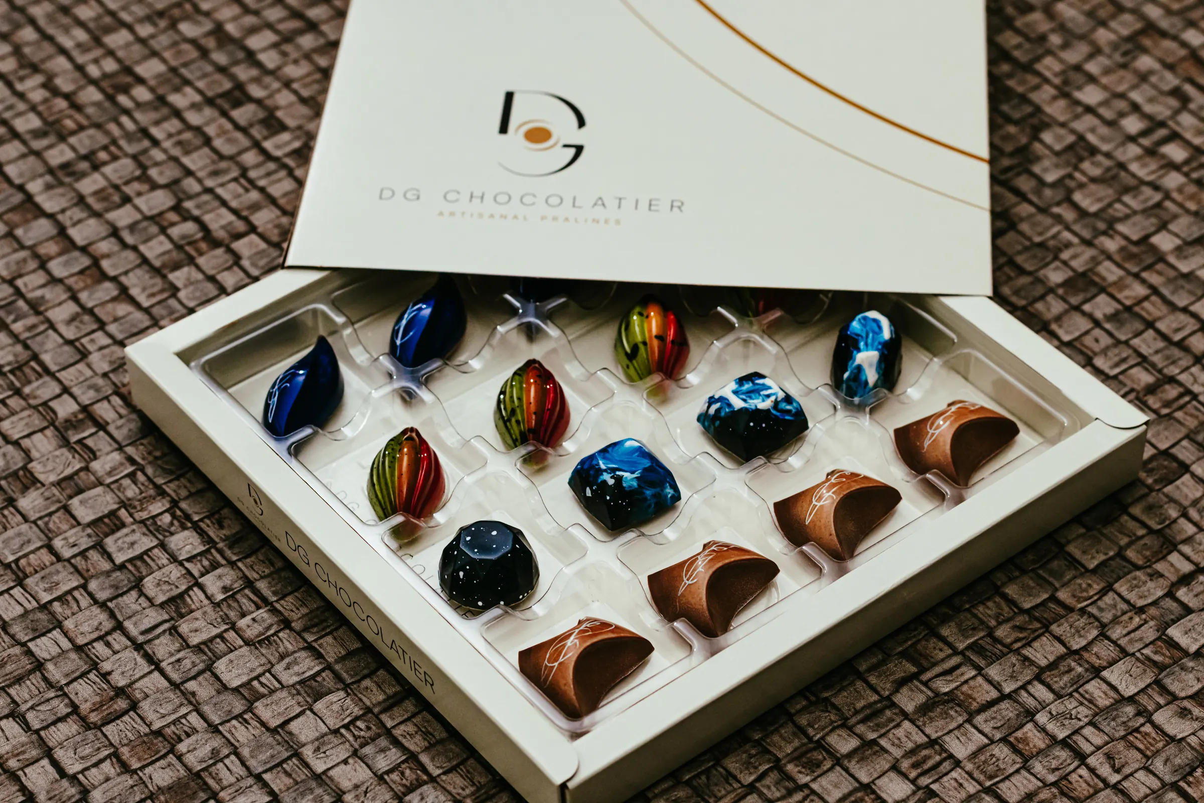Box of sixteen handmade pralines by DG Chocolatier
