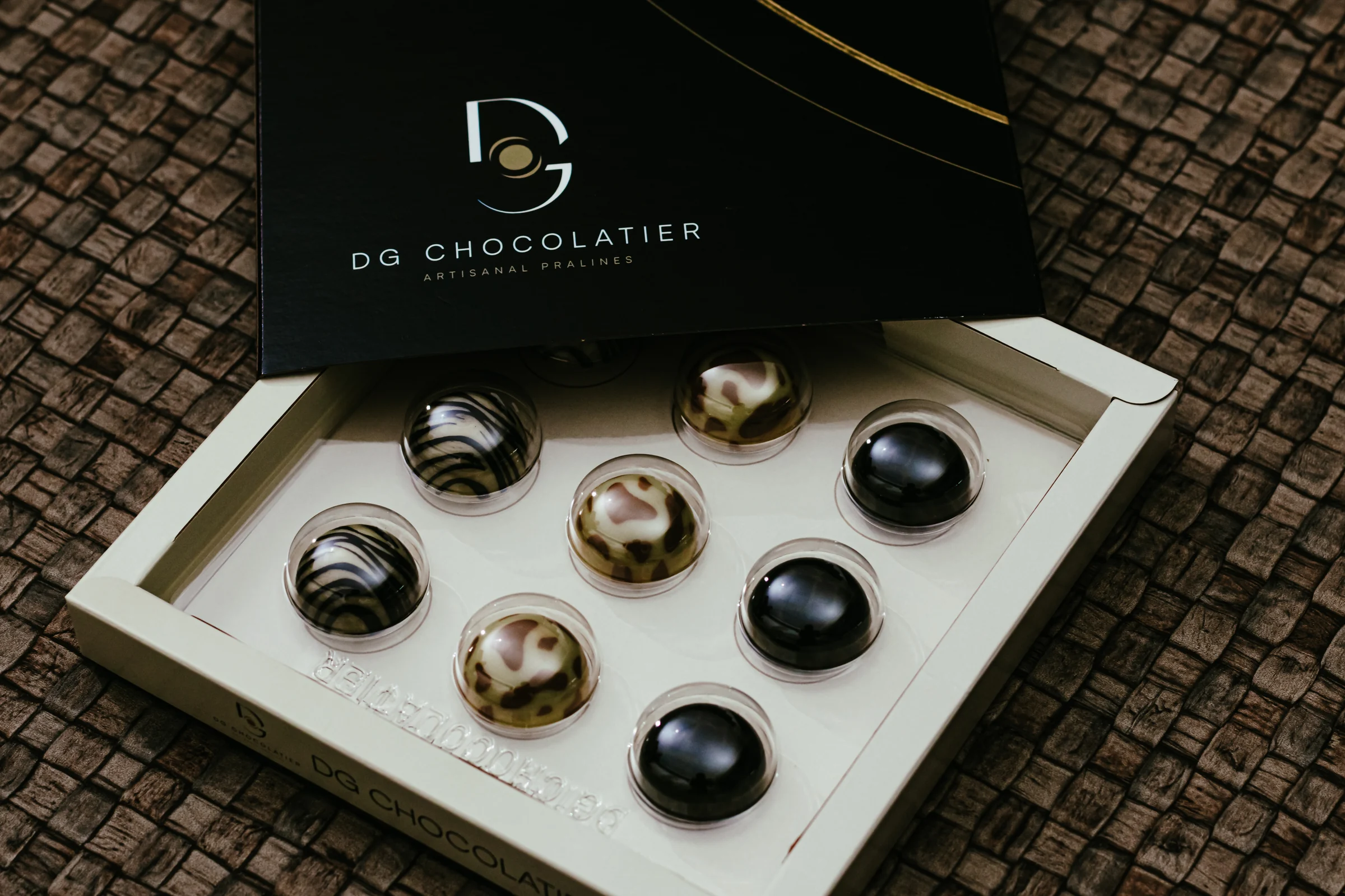 Box of nine handmade pralines by DG Chocolatier, a New Year gift